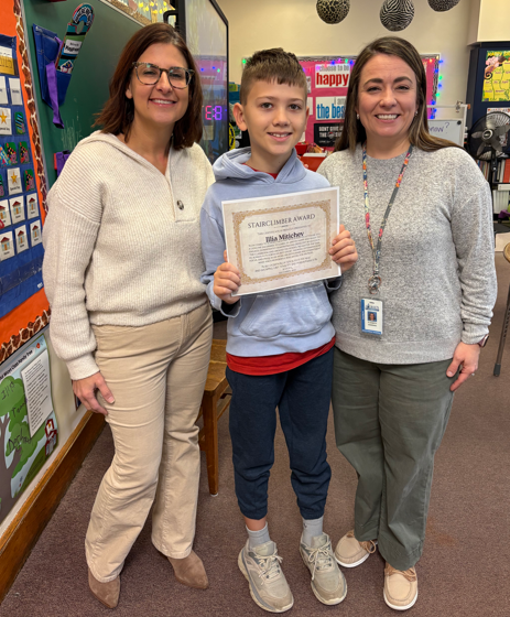 Illia Mitichev, Jefferson's Stairclimber for December, poses with his award plaque.